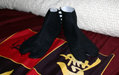 A pair of black Japanese tabi socks.