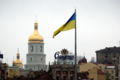 The Flag of Ukraine waving over Kiev's Maidan Nezalezhnosti