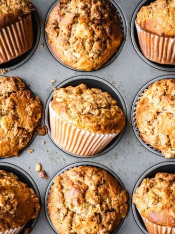 Apple oatmeal muffins in a muffin tin.