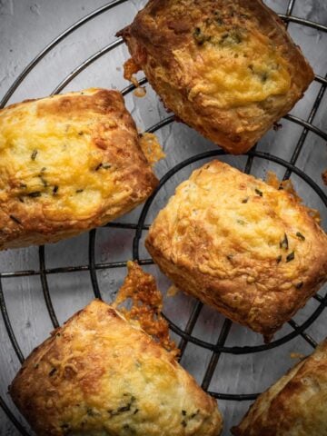 Cheddar biscuits on a cooling rack.