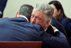 SANTA FE, NEW MEXICO - JULY 12: Alec Baldwin hugs his attorney Alex Spiro at the conclusion of his trial for involuntary manslaughter in First Judicial District Court on July 12, 2024 in Santa Fe, New Mexico. The trial for involuntary manslaughter was dismissed by a judge Friday after she ruled that key evidence over a fatal shooting on the set of "Rust" had been withheld from the defense. (Photo by Ramsay de Give-Pool/Getty Images)