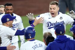 LOS ANGELES, CALIFORNIA - OCTOBER 25: Freddie Freeman #5 of the Los Angeles Dodgers celebrates with teammates after hitting a walk-off grand slam during the tenth inning against the New York Yankees during Game One of the 2024 World Series at Dodger Stadium on October 25, 2024 in Los Angeles, California. (Photo by Steph Chambers/Getty Images)