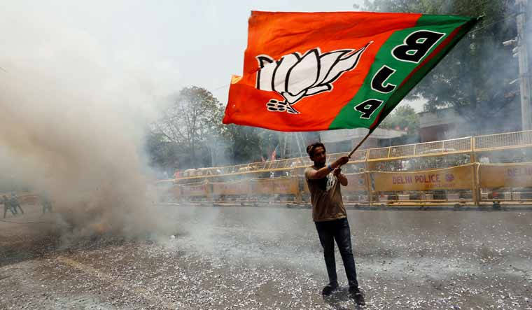 A Devoted BJP Supporter Proudly Waving Party Flag Wallpaper