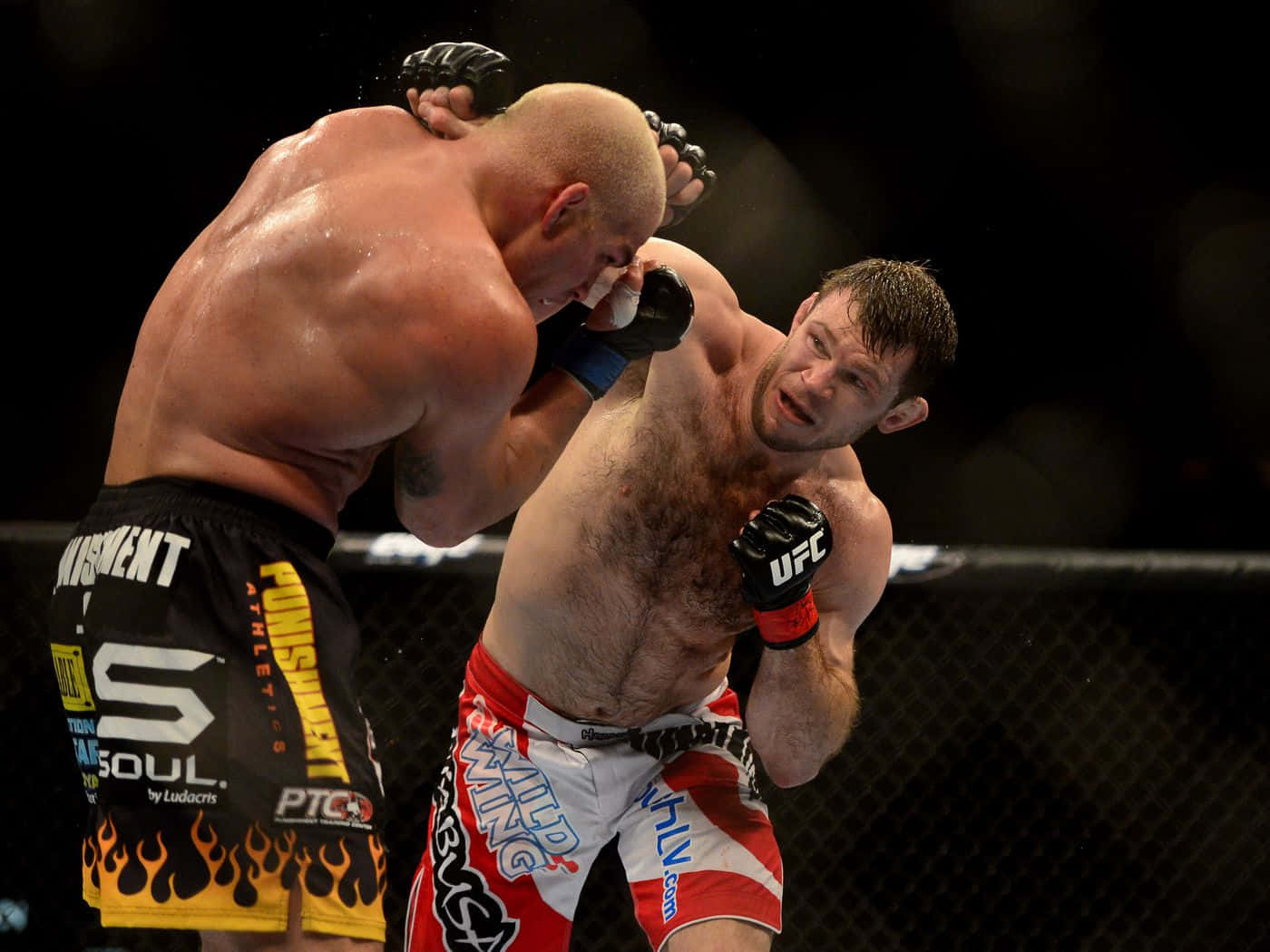 Forrest Griffin in intense UFC match against Tito Ortiz. Wallpaper