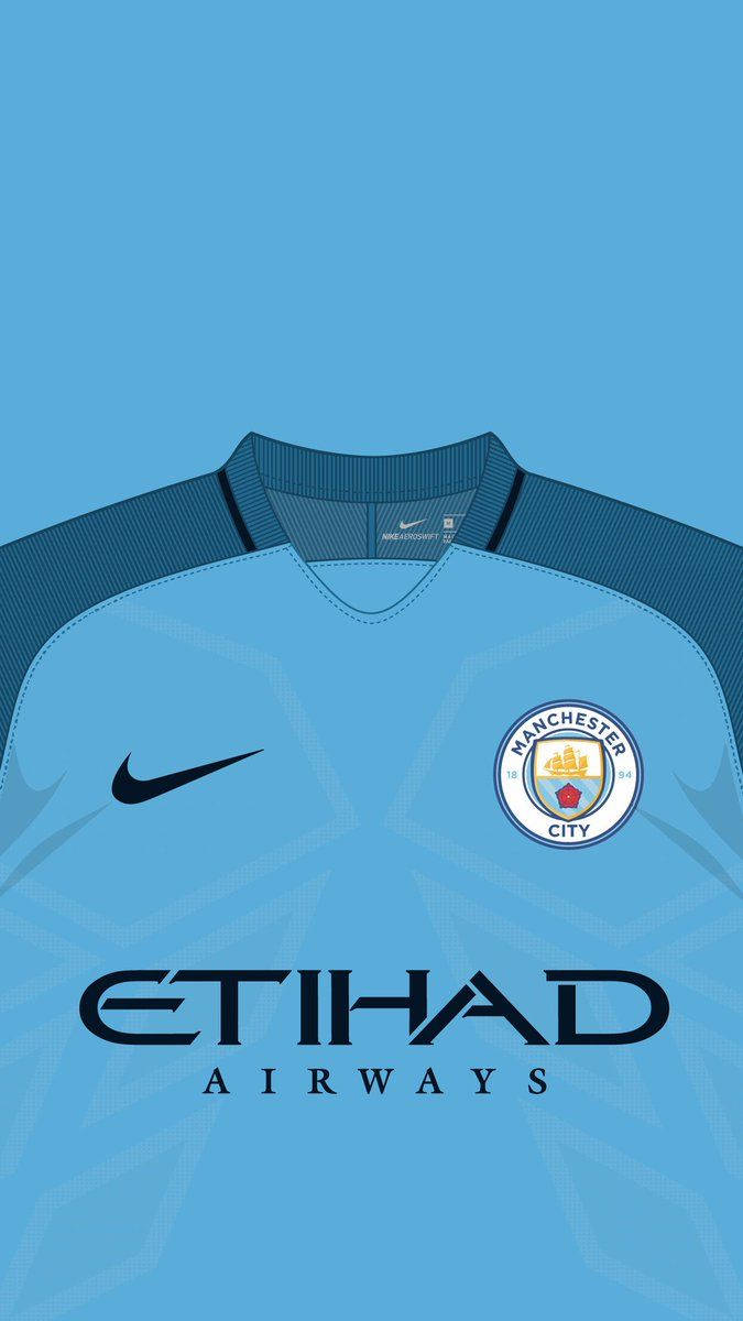 Manchester City Logo På Blå Jersey Tapet Wallpaper