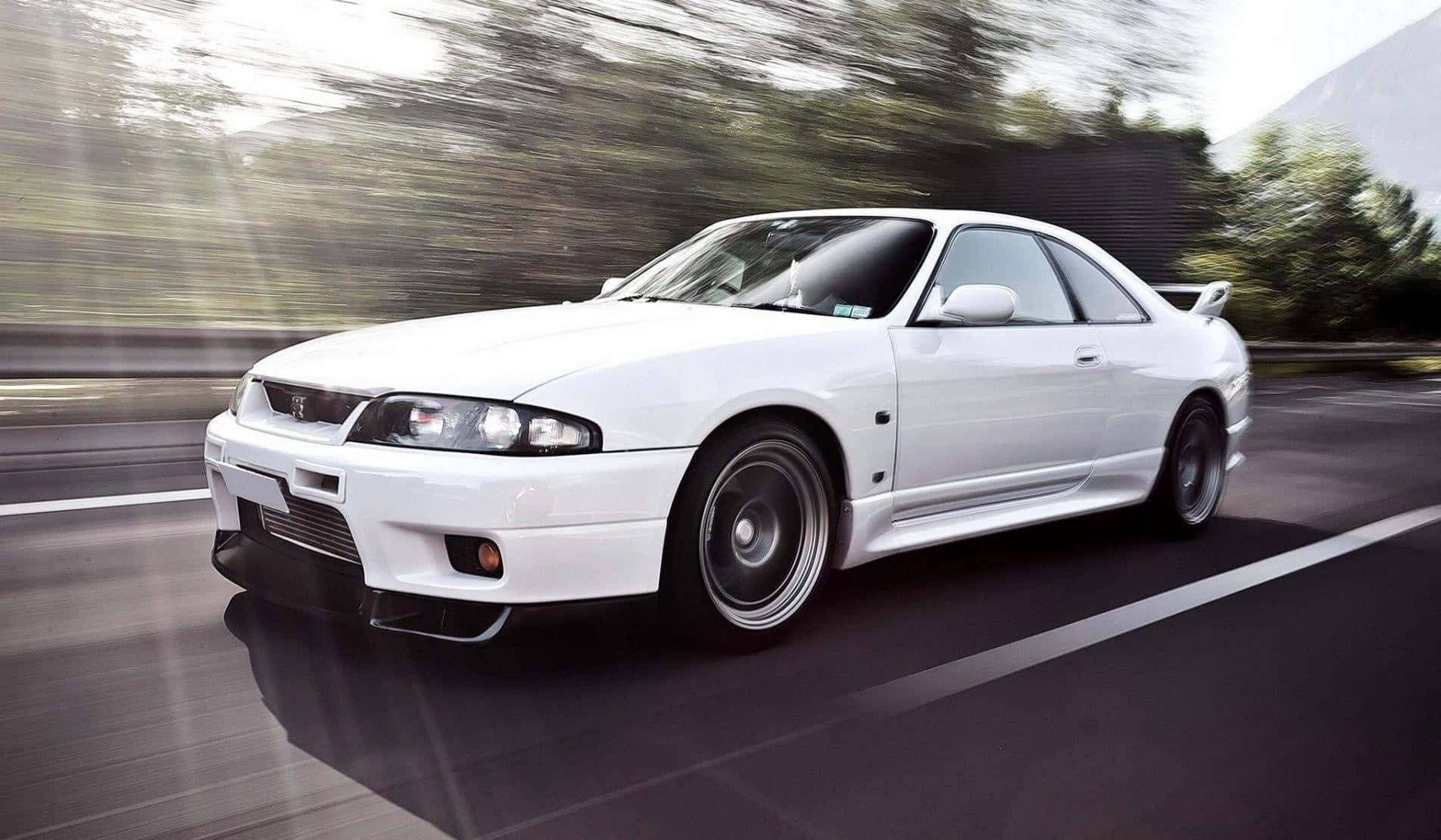 White Nissan R33 Gtr Driving Fast Wallpaper