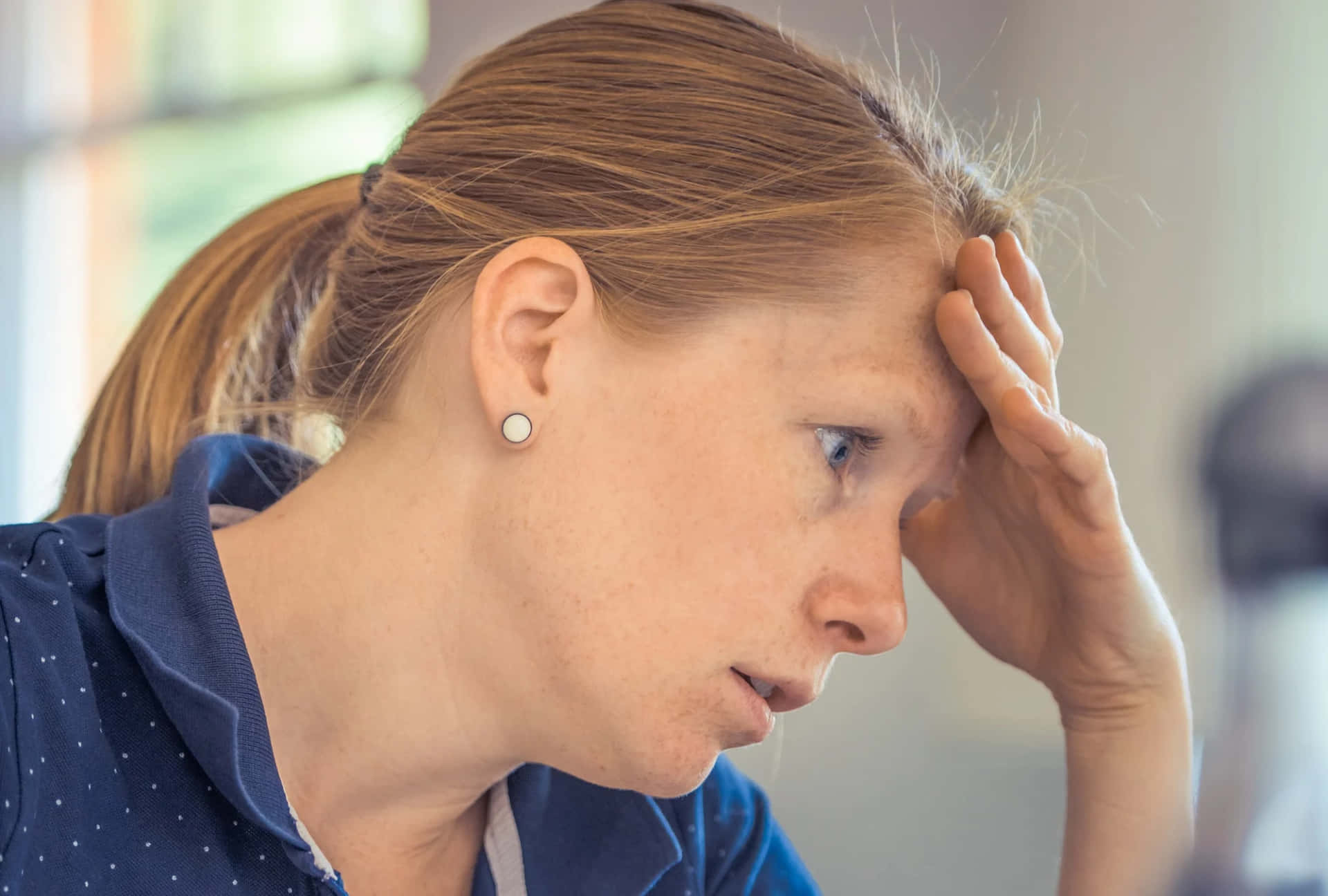 Side View Of A Perturbed Woman Wallpaper