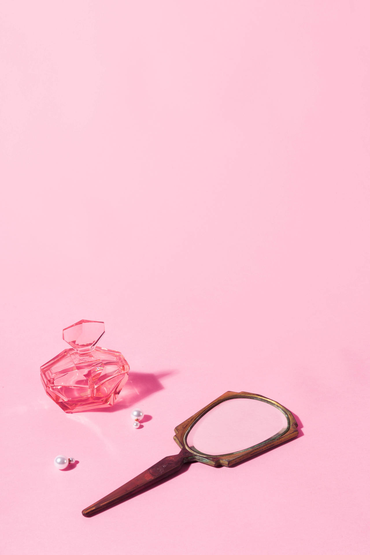 Trinkets On A Pink Color Wallpaper