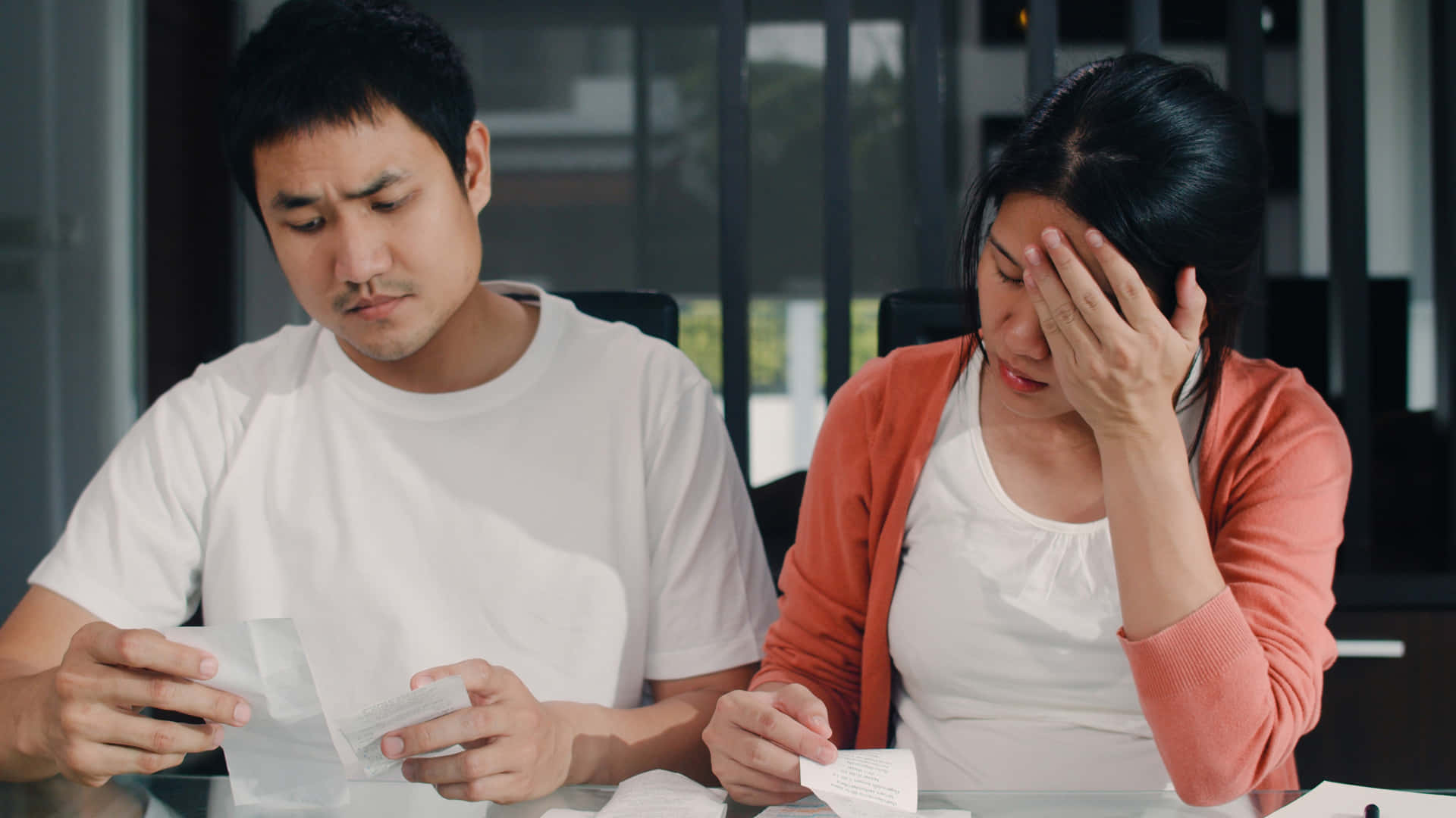 Young Couple Perturbed By Bills Wallpaper