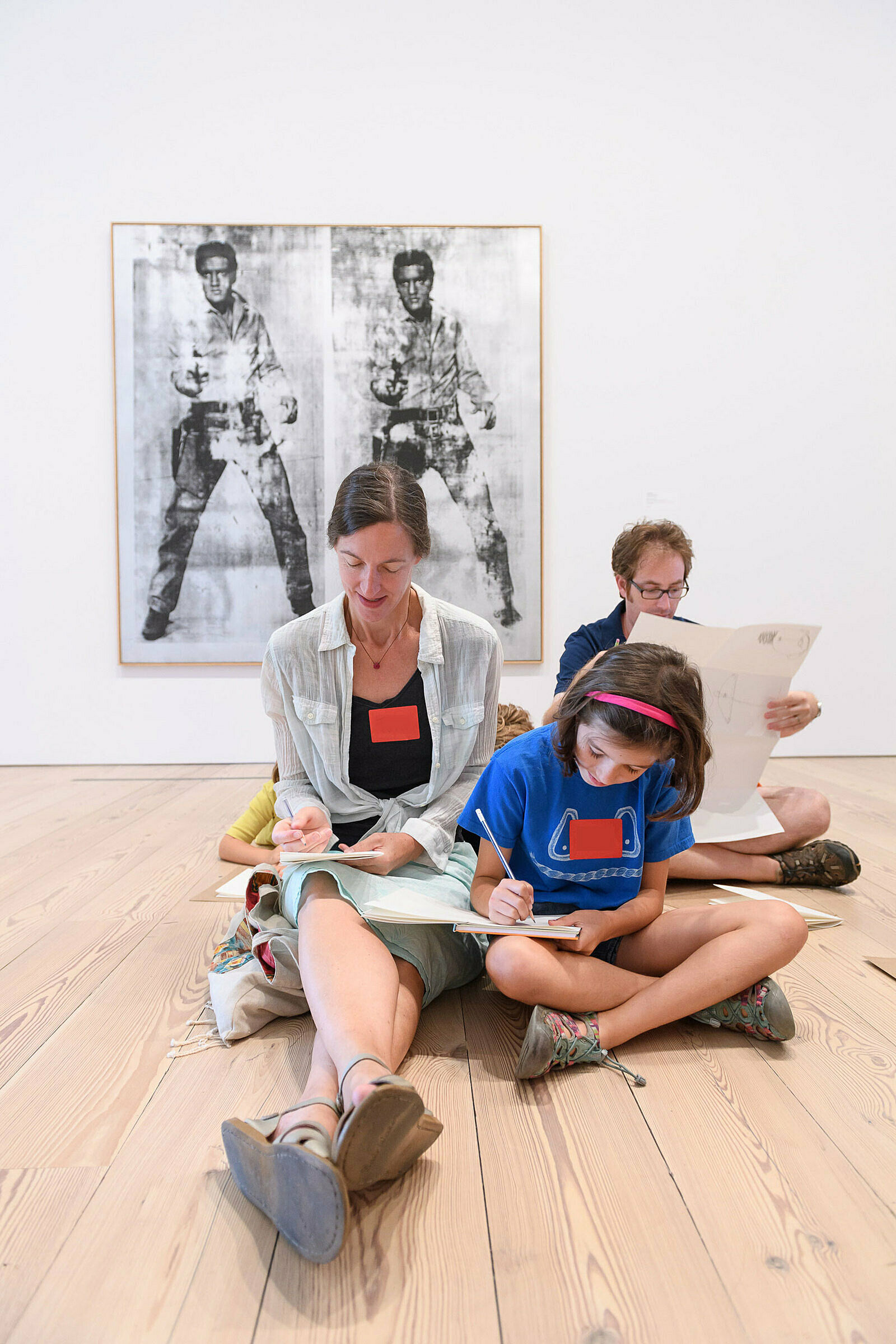 Families sketching in the galleries.