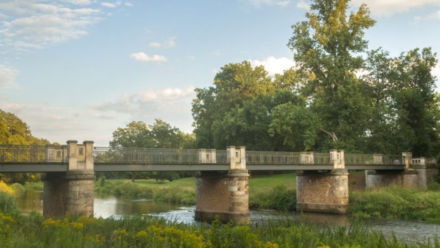 Article thumbnail: The Lusatian Neisse River in Bad Muskau on the Germany-Poland border (Photo: aureliano1704/Getty Images)