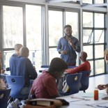 Article thumbnail: Confident young male professor explaining multi-ethnic students in community college classroom