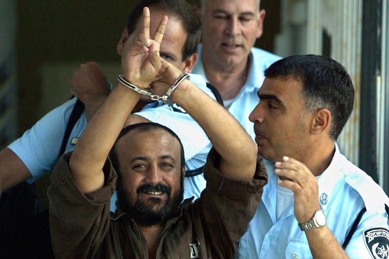 TEL AVIV - SEPTEMBER29: (ISRAEL OUT) Palestinian leader Marwan Barghouti is taken away under escort September 29, 2003 in Tel Aviv, Israel after continued proceedings in his trial in the Tel Aviv District Court. Barghouti, head of the Fatah Tanzim movement, refused to testify in his trial charging that the outcome of the court case was predetermined. Israel has charged Barghouti with leading and conducting suicide attacks on Israeli targets and is accused of murder and attempted murder. (Photo by Uriel Sinai/Getty Images)