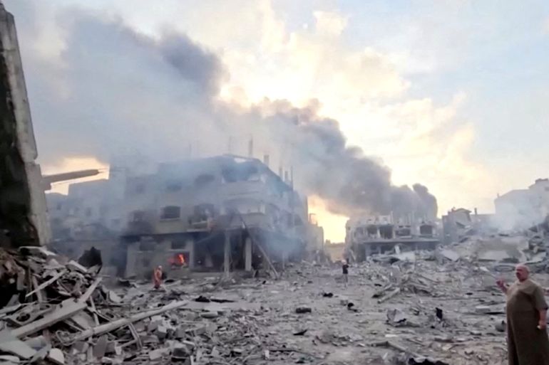 FILE PHOTO: People survey the destruction at Gaza's Jabalia refugee camp, following Israeli strikes on the enclave, October 14, 2023 in this still image from video obtained by REUTERS/File Photo ATTENTION EDITORS - THIS IMAGE HAS BEEN SUPPLIED BY A THIRD PARTY.