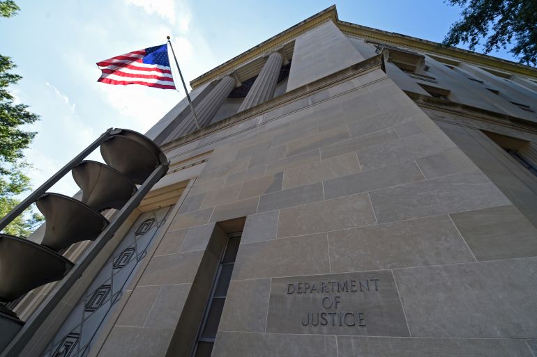 The view of the Justice Department in Washington, Thursday, Aug. 27, 2015. The Associated Press sued the U.S. Department of Justice Thursday over the FBI's failure to provide public records related to the creation of a fake news story used to plant surveillance software on a suspect's computer. (AP Photo/Susan Walsh)