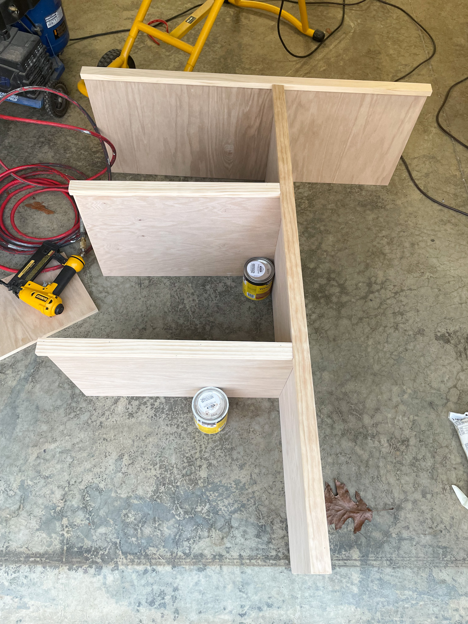 showing the closet shelves laid out before assembly