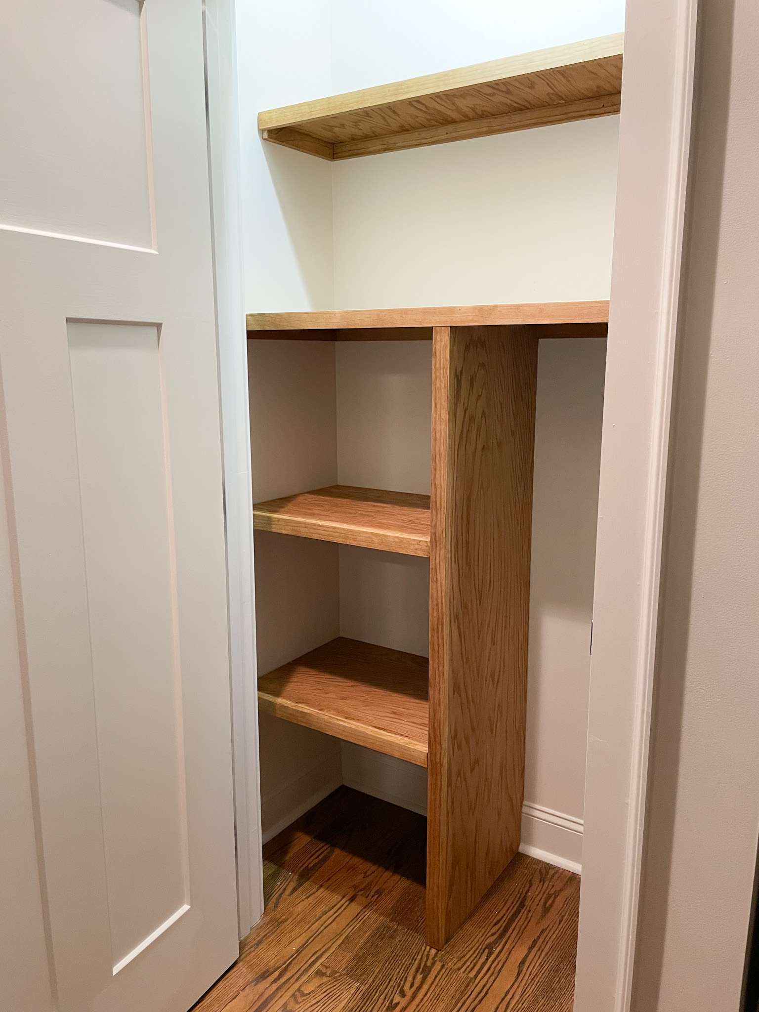 part of the wood shelves in the closet