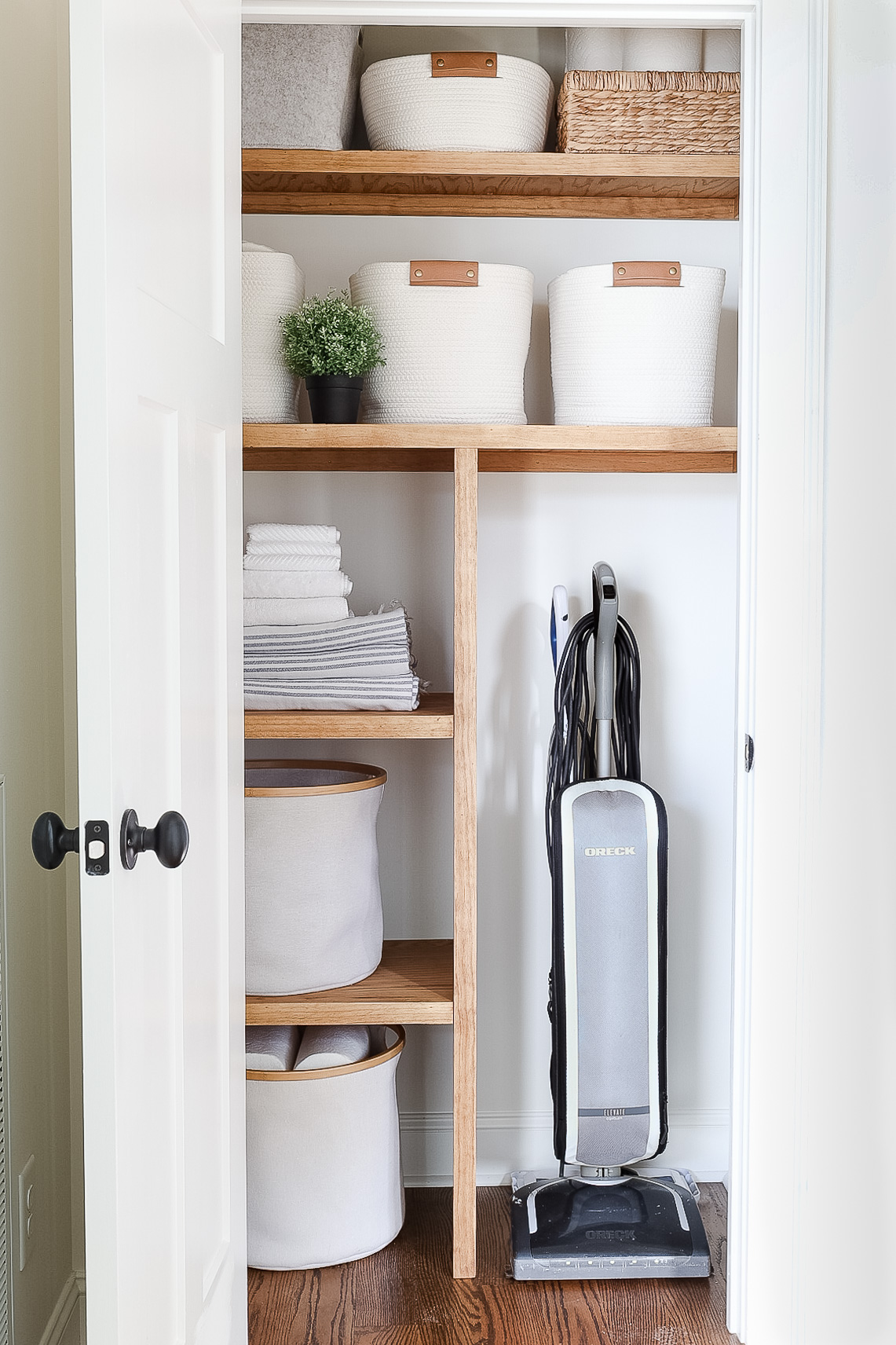 hall closet with storage containers