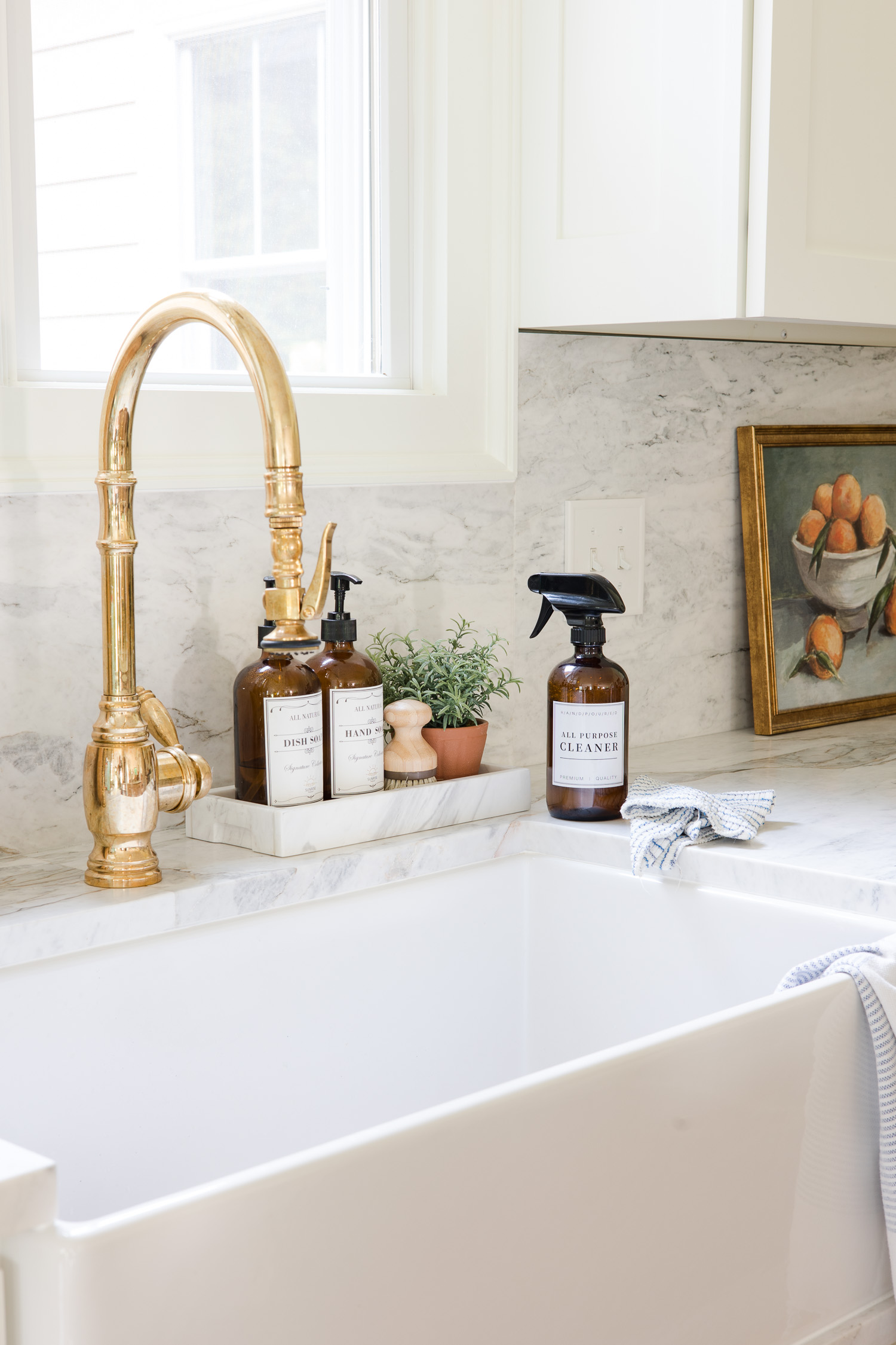 all purpose cleaner in amber glass bottle sitting on countertop next to sink