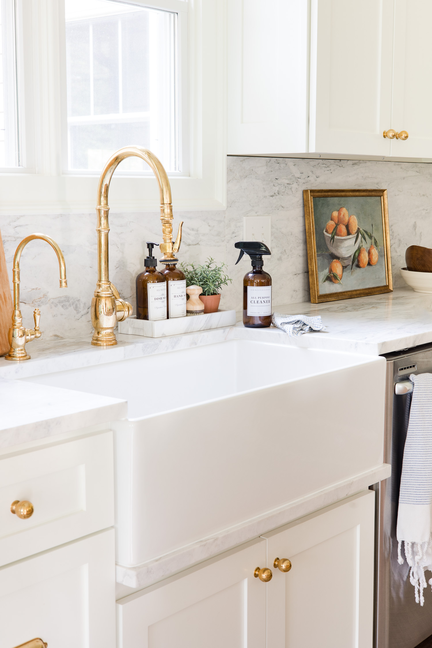 all purpose cleaner in amber glass bottle sitting on countertop next to sink