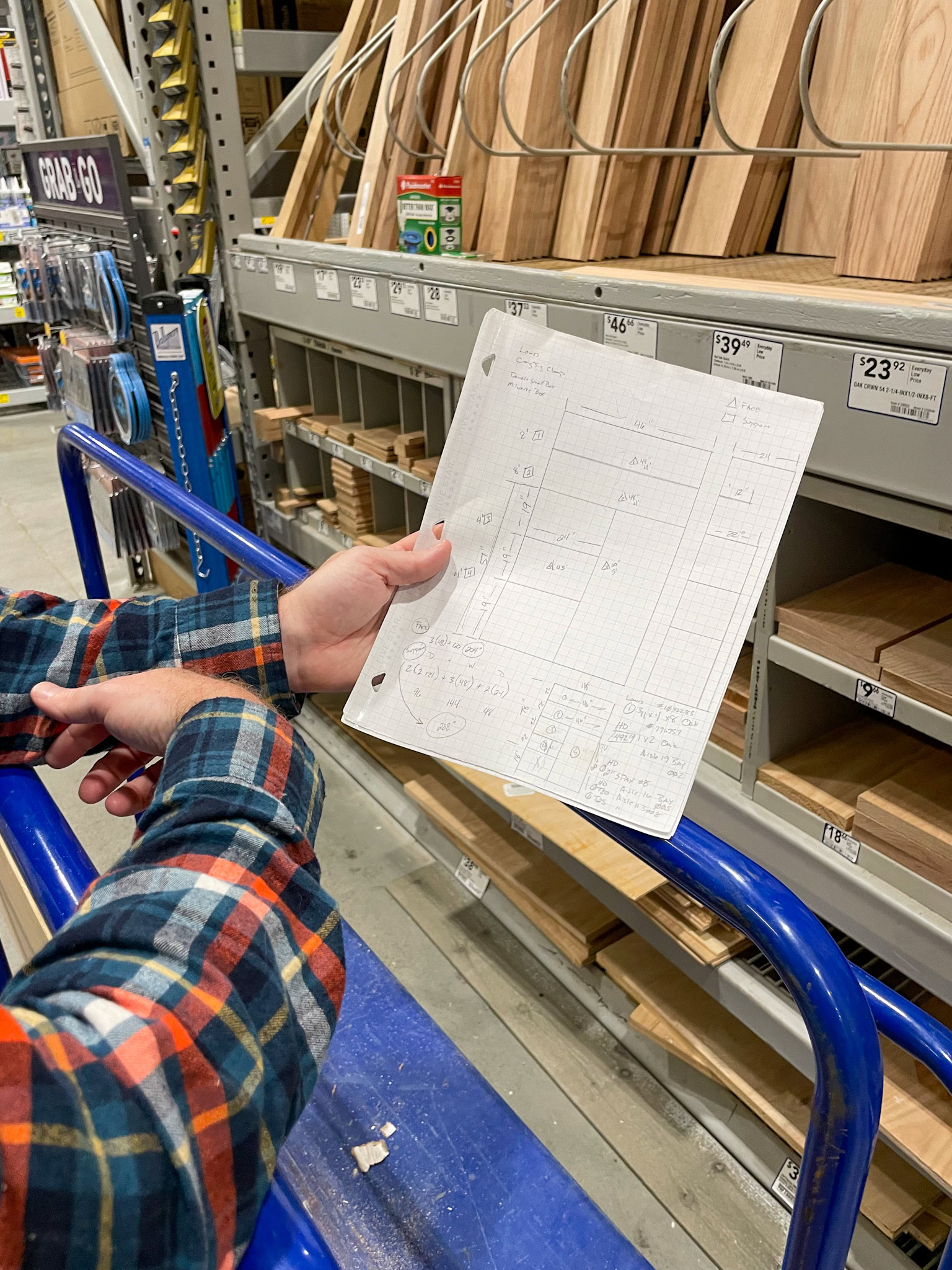 holding a sketch of the closet