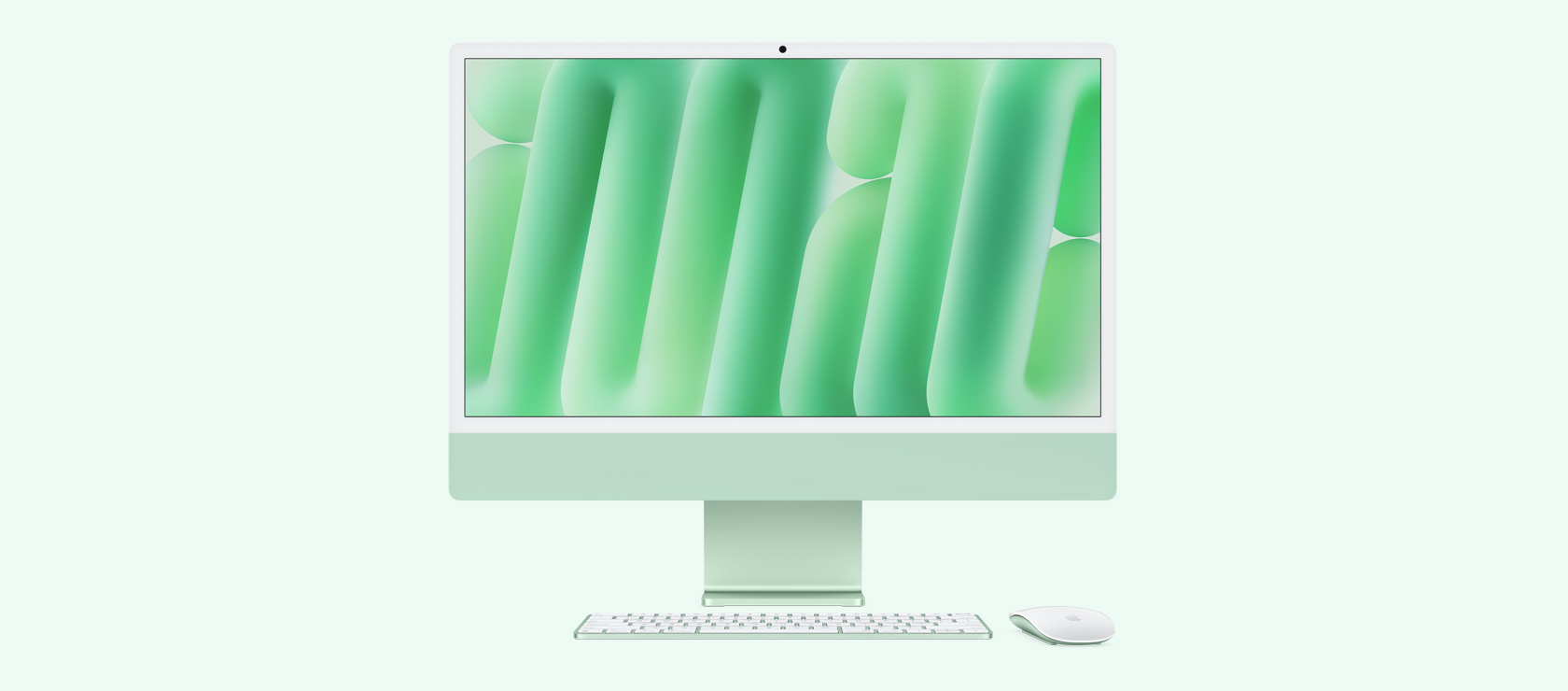 Изглед на зелен iMac отпред с мишка и клавиатура в съответстващ цвят