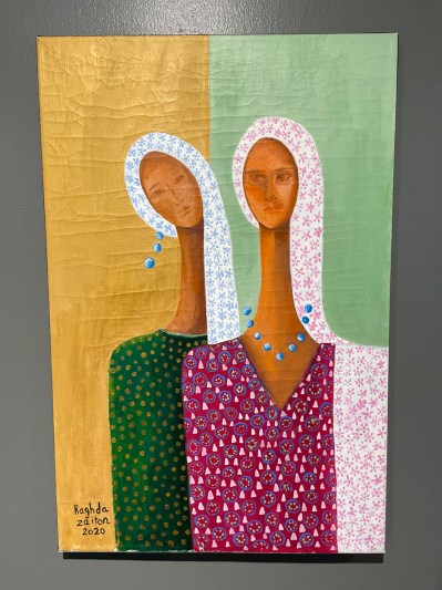 Painting of two long necked women in patterned hijabs against a gold and green color blacked background.