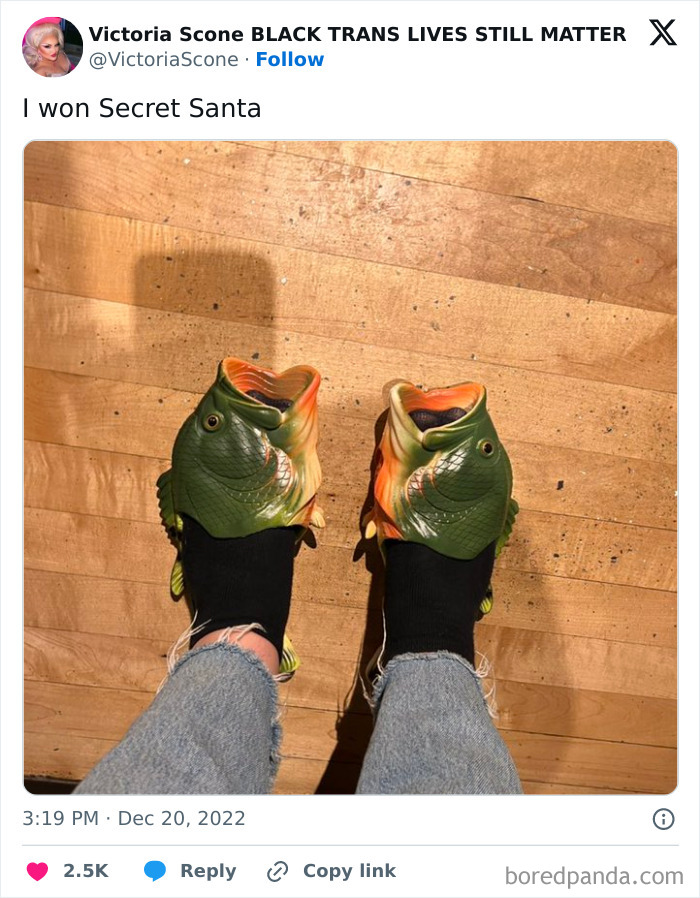 Fish-shaped slippers on feet, showcasing a hilarious trolling Christmas gift.