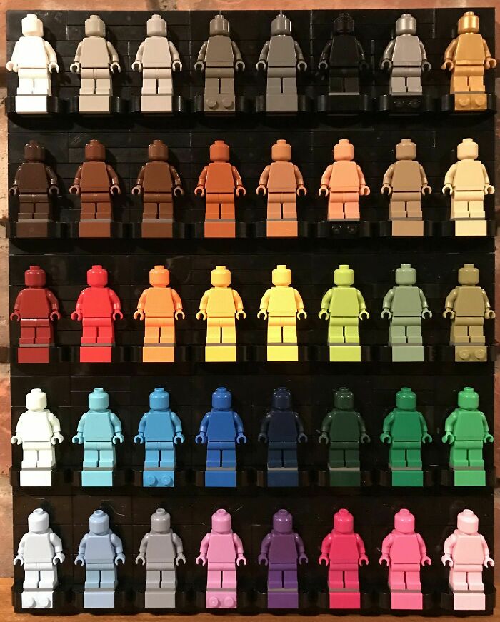 Unique collection of colorful Lego minifigures arranged in a gradient pattern.