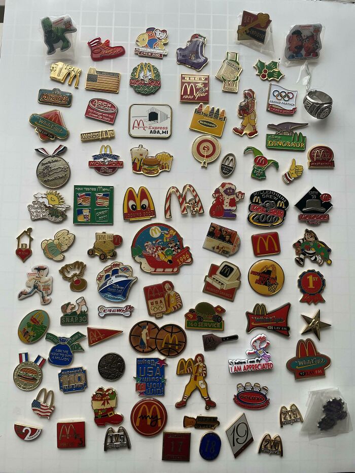 Assorted pins showcasing unexpected unique collections on a grid background.