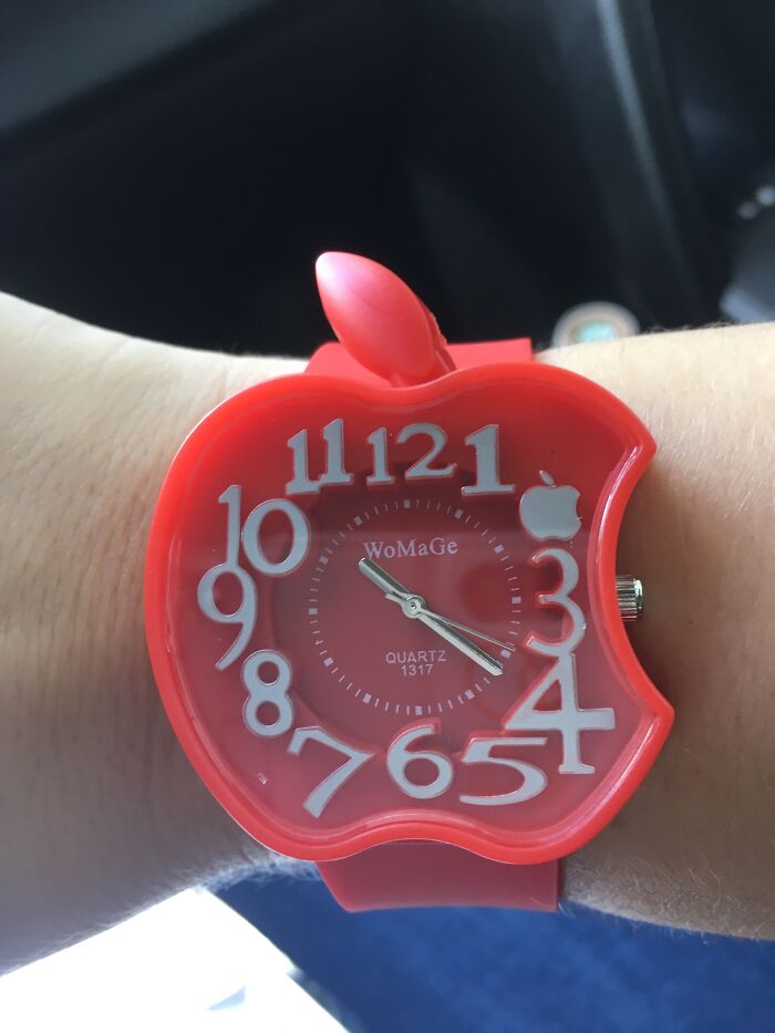 Red apple-shaped watch with jumbled numbers, a perfect example of hilarious trolling Christmas gifts.