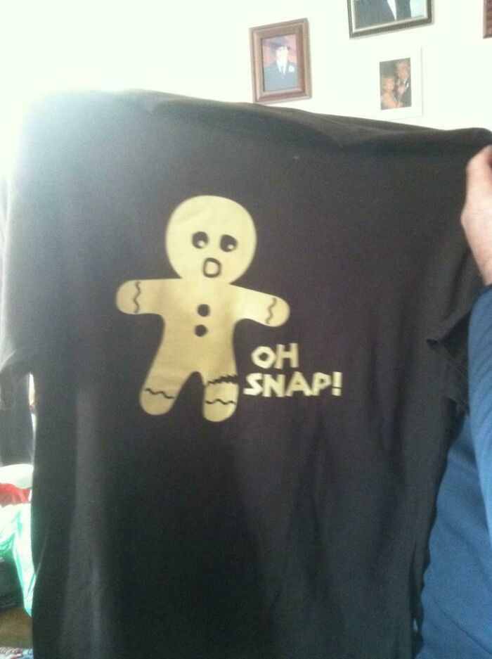 T-shirt with a broken gingerbread man saying "Oh Snap," a funny Christmas gift.