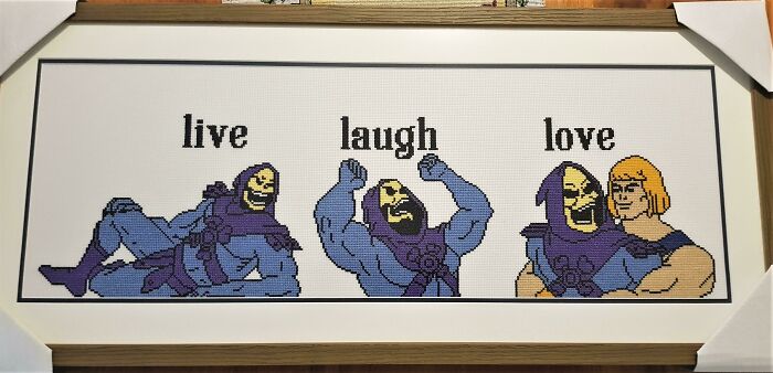 Cross-stitched Skeletor trolling design with "live laugh love," perfect as a funny Christmas gift.