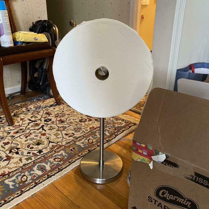 Giant toilet paper roll on a stand, a hilarious trolling Christmas gift idea.