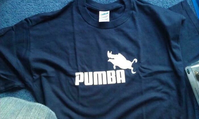 T-shirt with "PUMBA" logo, featuring a warthog, represents hilarious trolling Christmas gifts.