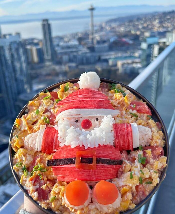 Festive Santa-themed Christmas snack food idea made with rice and vegetables, overlooking a city skyline.