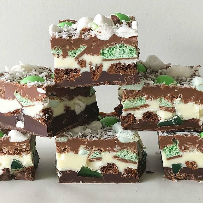 Christmas snack food idea featuring layered chocolate slices with mint and coconut toppings.