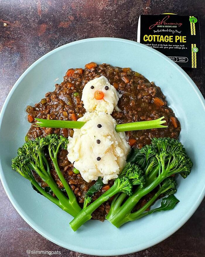 Christmas snack food ideas featuring a mashed potato snowman on cottage pie with broccoli.