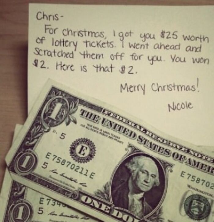 Trolling Christmas gift with a note and two one-dollar bills.