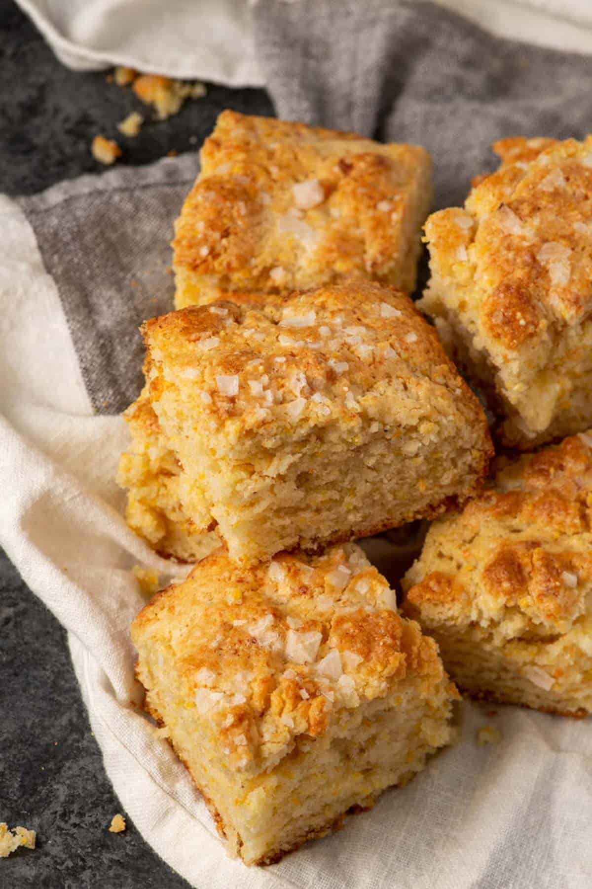 Squares of cornbread on a linen napkin