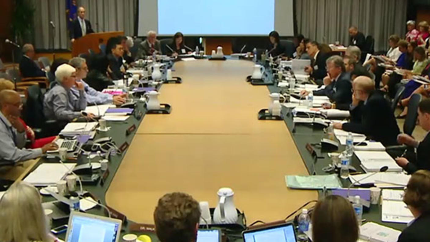 NCI advisory board members seated around a conference table.