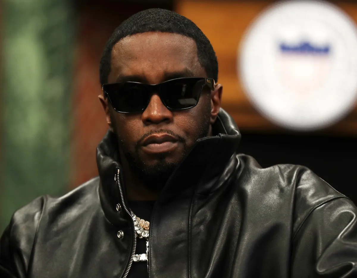 Sean Diddy Combs wearing sunglasses and a black leather jacket