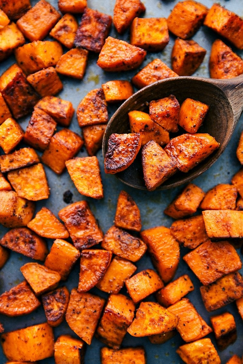 Finished roasted sweet potatoes on a sheet pan