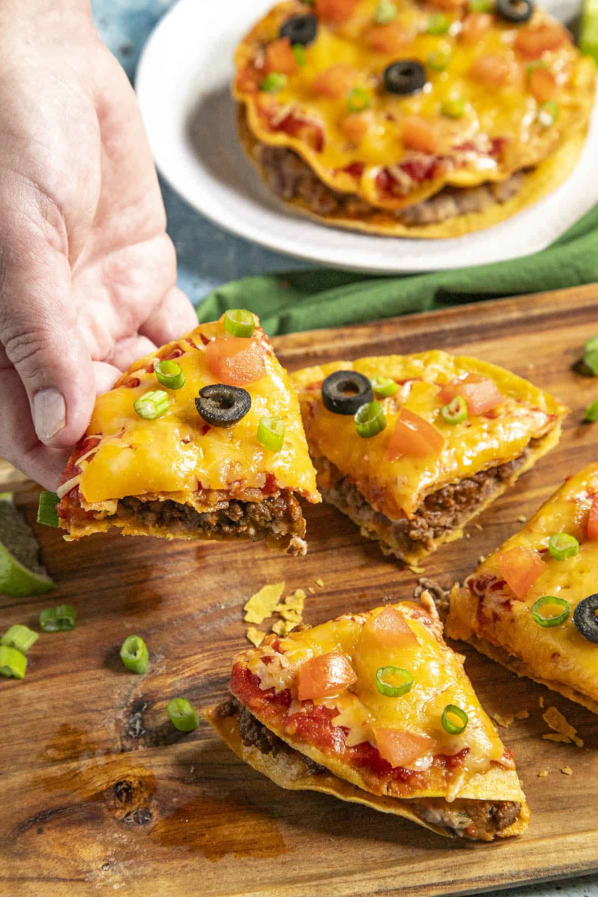 Mike taking a piece of Mexican pizza