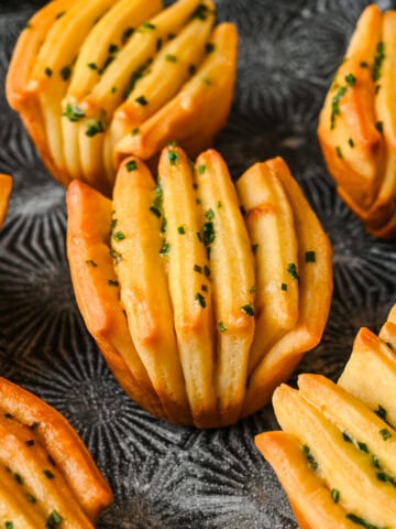 side view of garlic herb butter fan rolls.