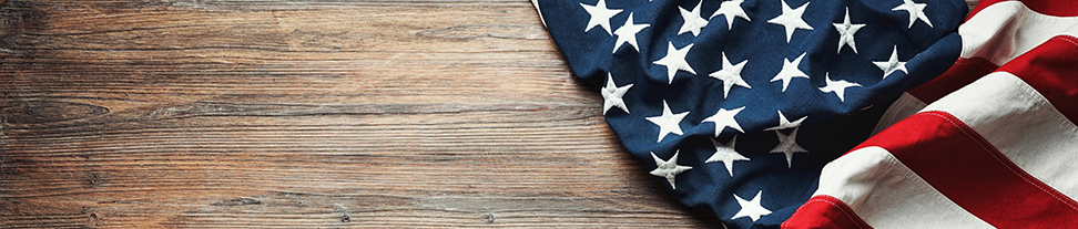 U.S. flag on a wooden table.