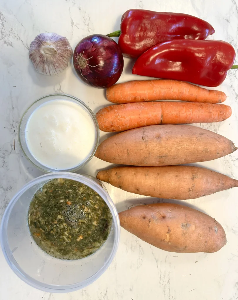 Roasted vegetables in a baking dish for sweet potato soup