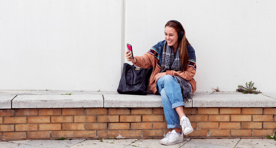 A student on the Forum piazza, talking on their phone