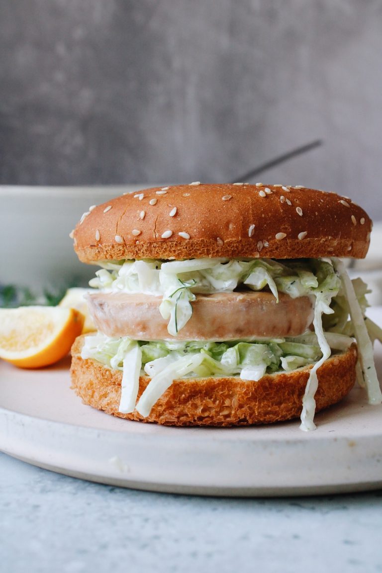 trader joes salmon burger on a bun with crunchy slaw