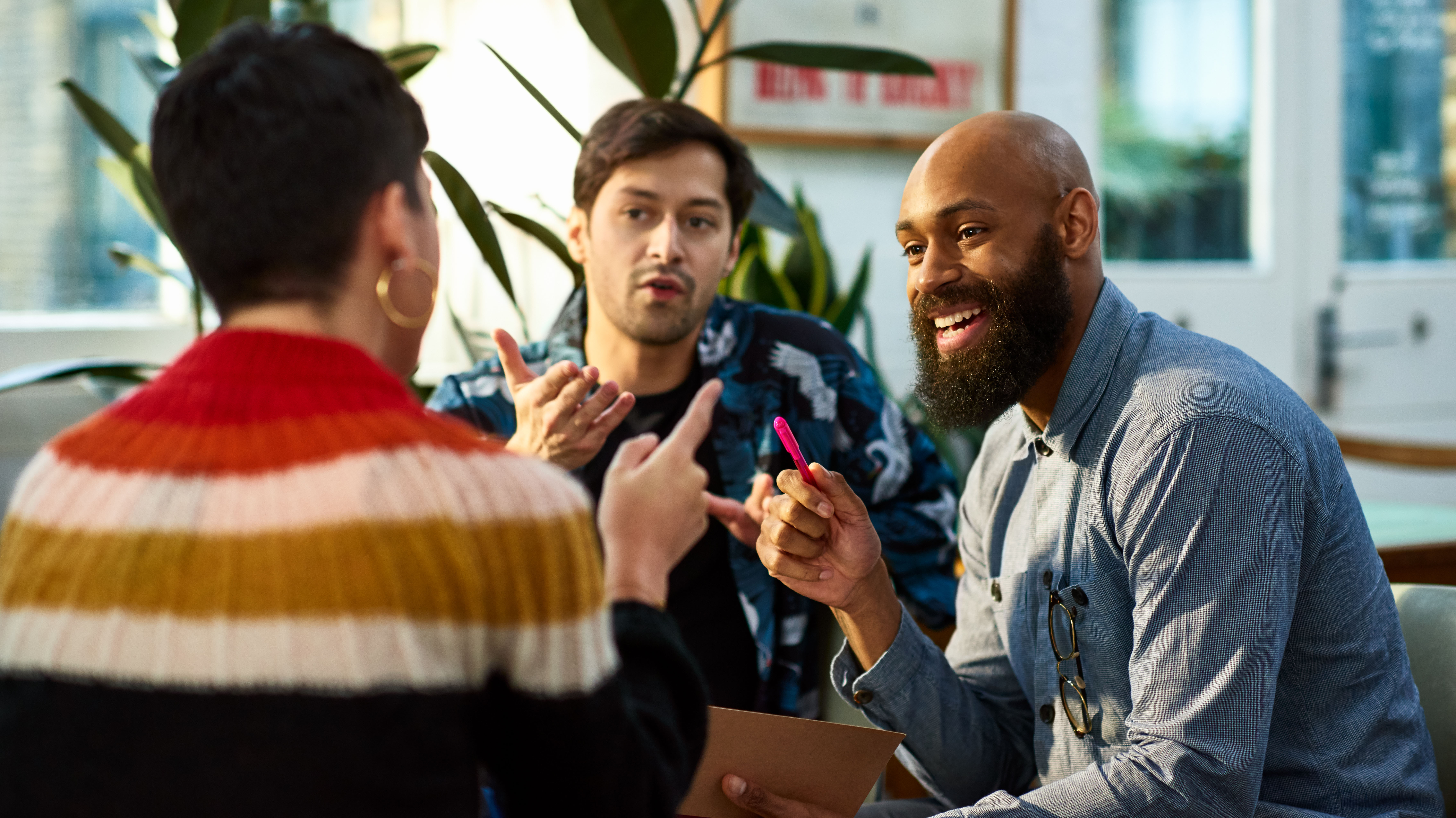 Three men in a conversation